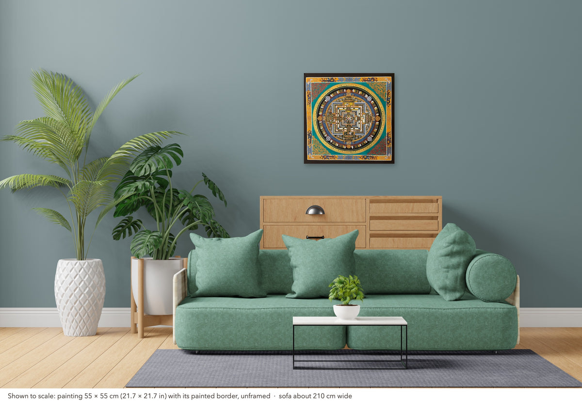 Kalachakra Mandala thangka shown to scale in a living room, unframed, above a sofa about 210 cm wide (55×55 cm)