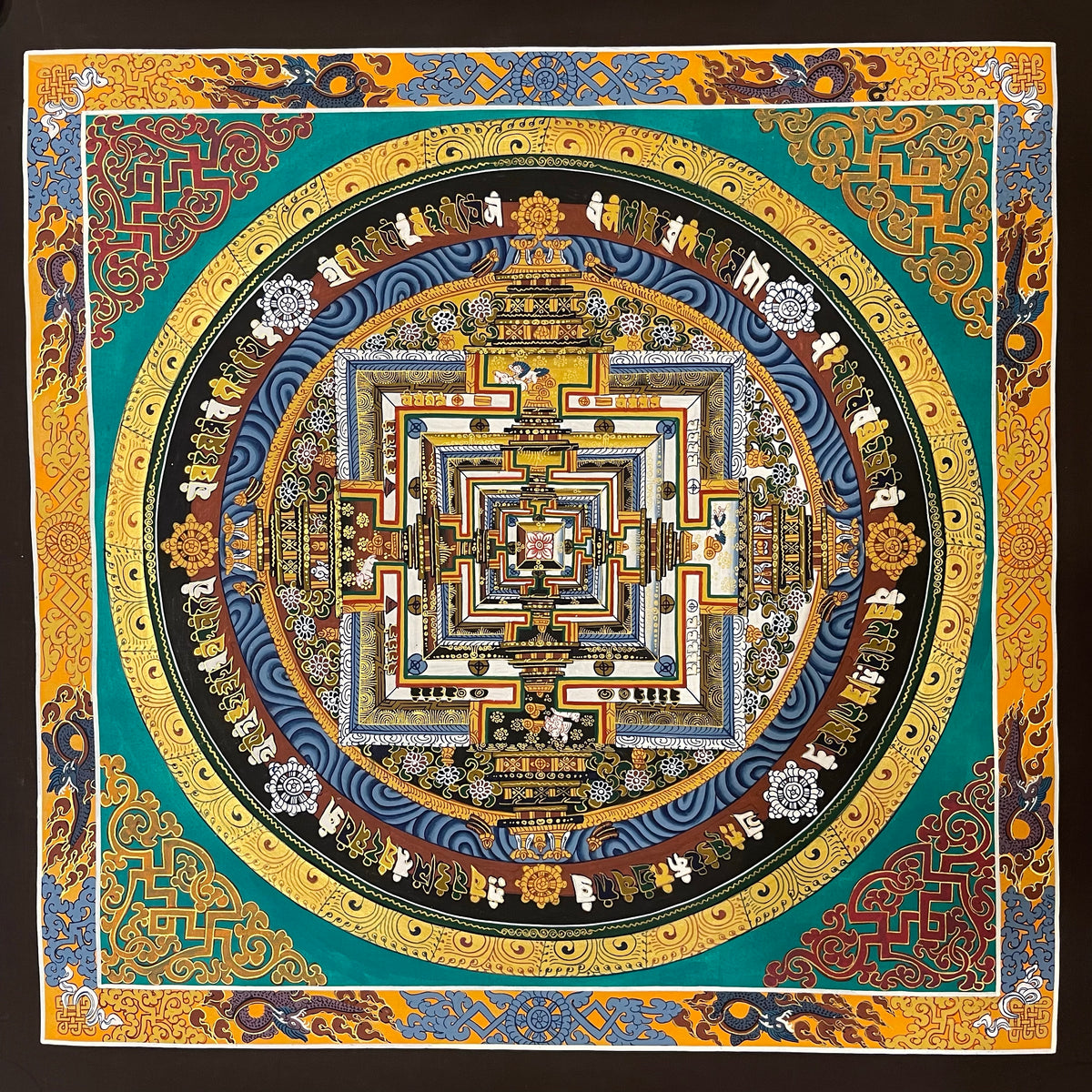 Kalachakra Mandala thangka, 55×55 cm: Kalachakra palace mandala on a teal ground, inside a border of dragons