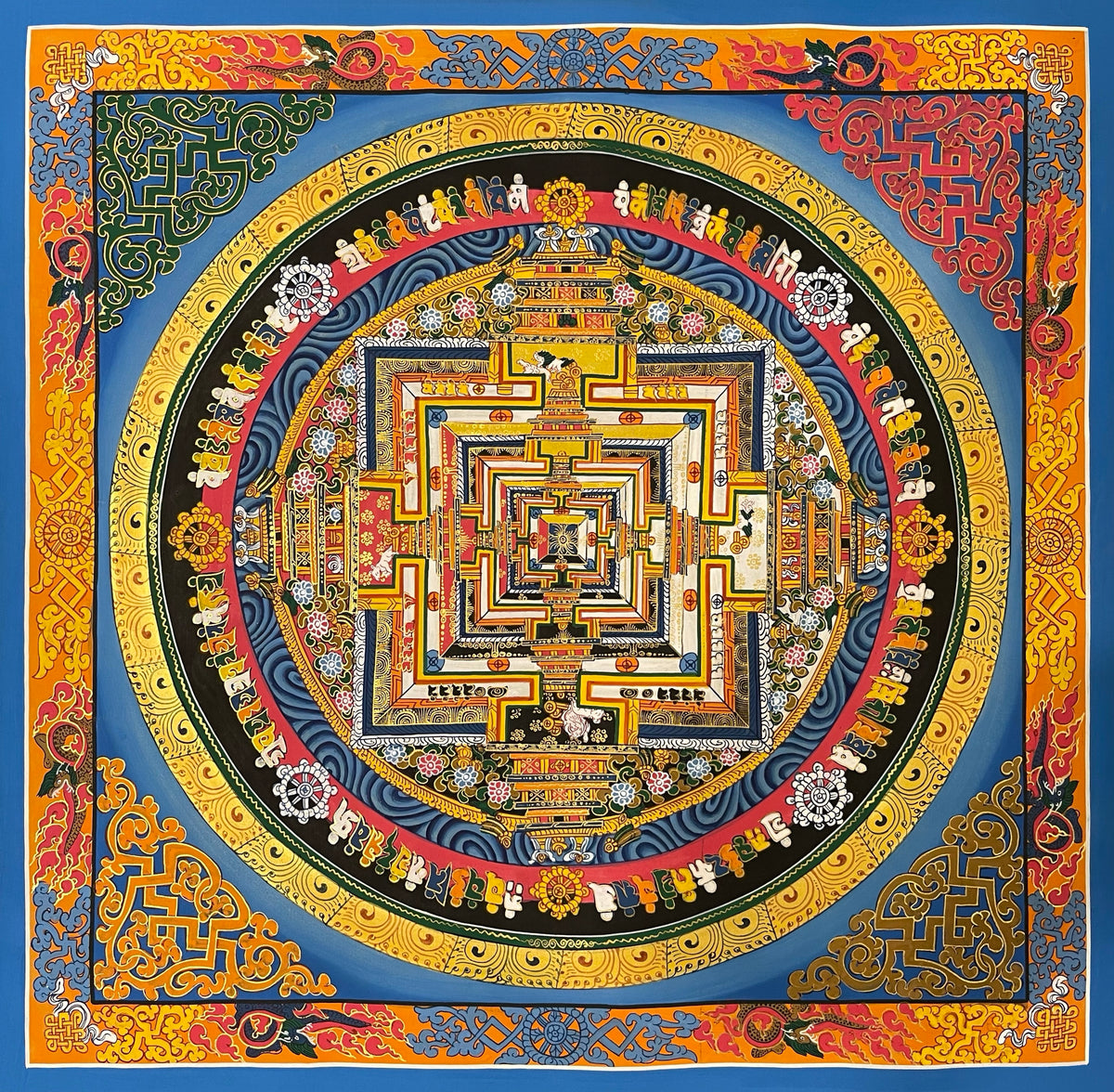 Kalachakra Mandala thangka, 55×55 cm: Kalachakra palace mandala on a bright blue ground, inside a border of dragons