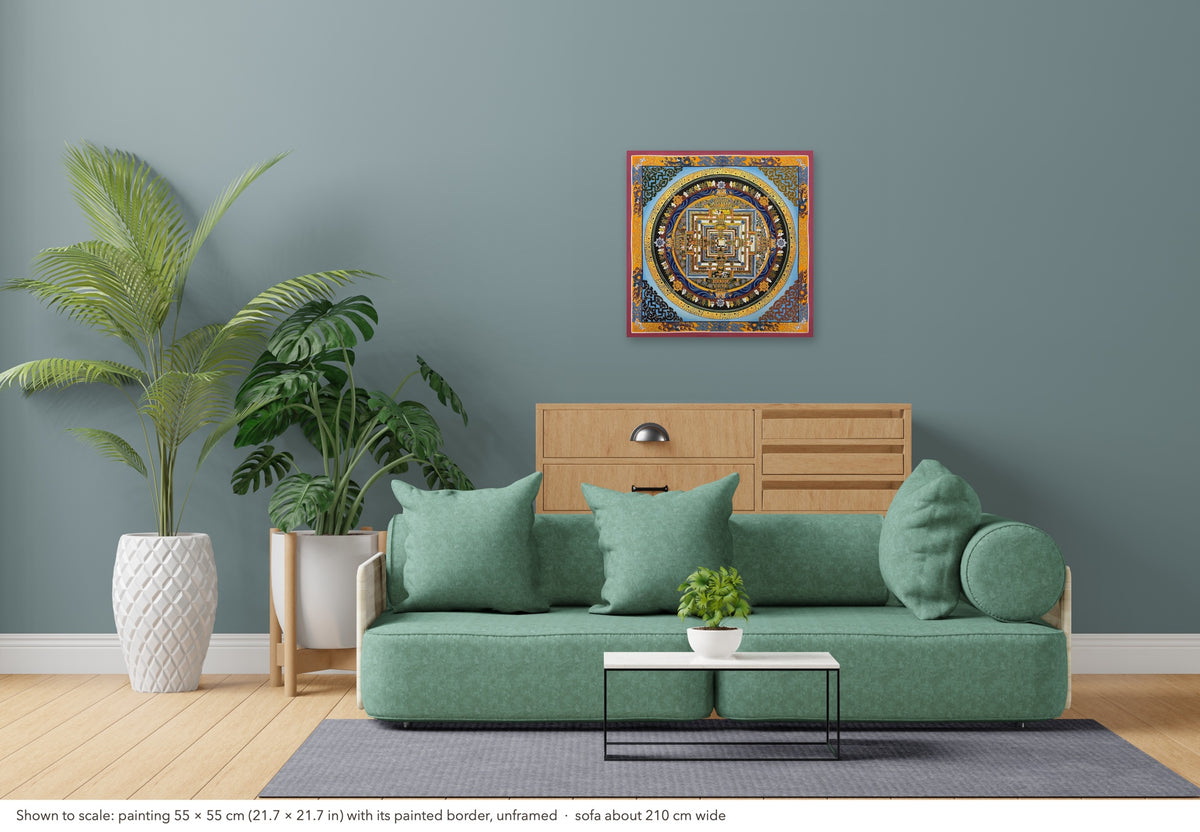 Kalachakra Mandala thangka shown to scale in a living room, unframed, above a sofa about 210 cm wide (55×55 cm)