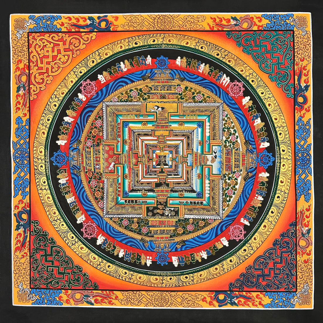 Kalachakra Mandala thangka, 55×55 cm: Kalachakra palace mandala on an orange ground glowing red at the corners, inside a border of dragons