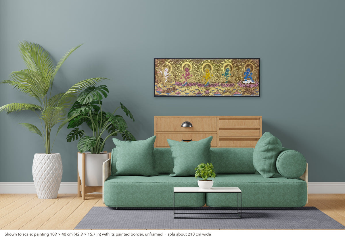 Jambhala Set thangka shown to scale in a living room, unframed, above a sofa about 210 cm wide (109×40 cm)