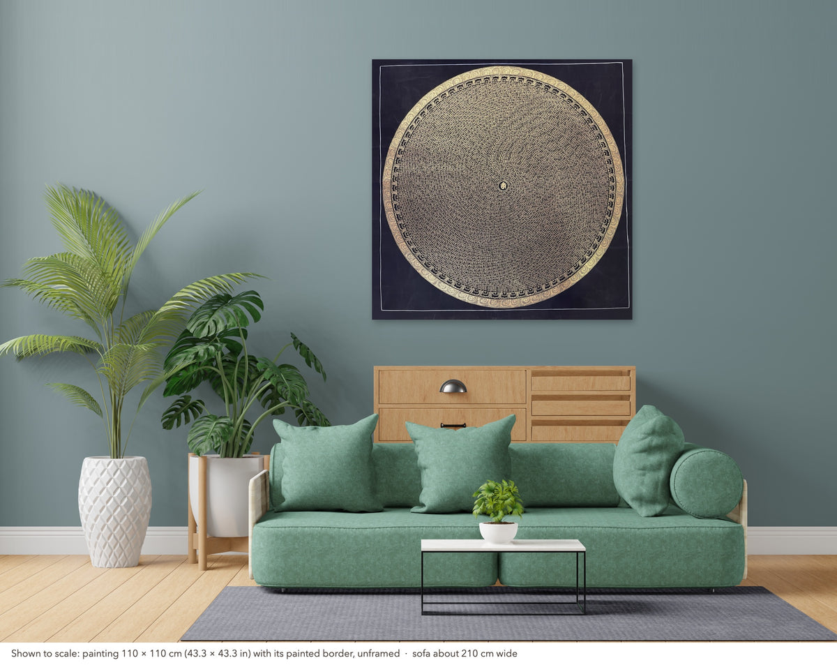 Mantra Mandala thangka shown to scale in a living room, unframed, above a sofa about 210 cm wide (110×110 cm)