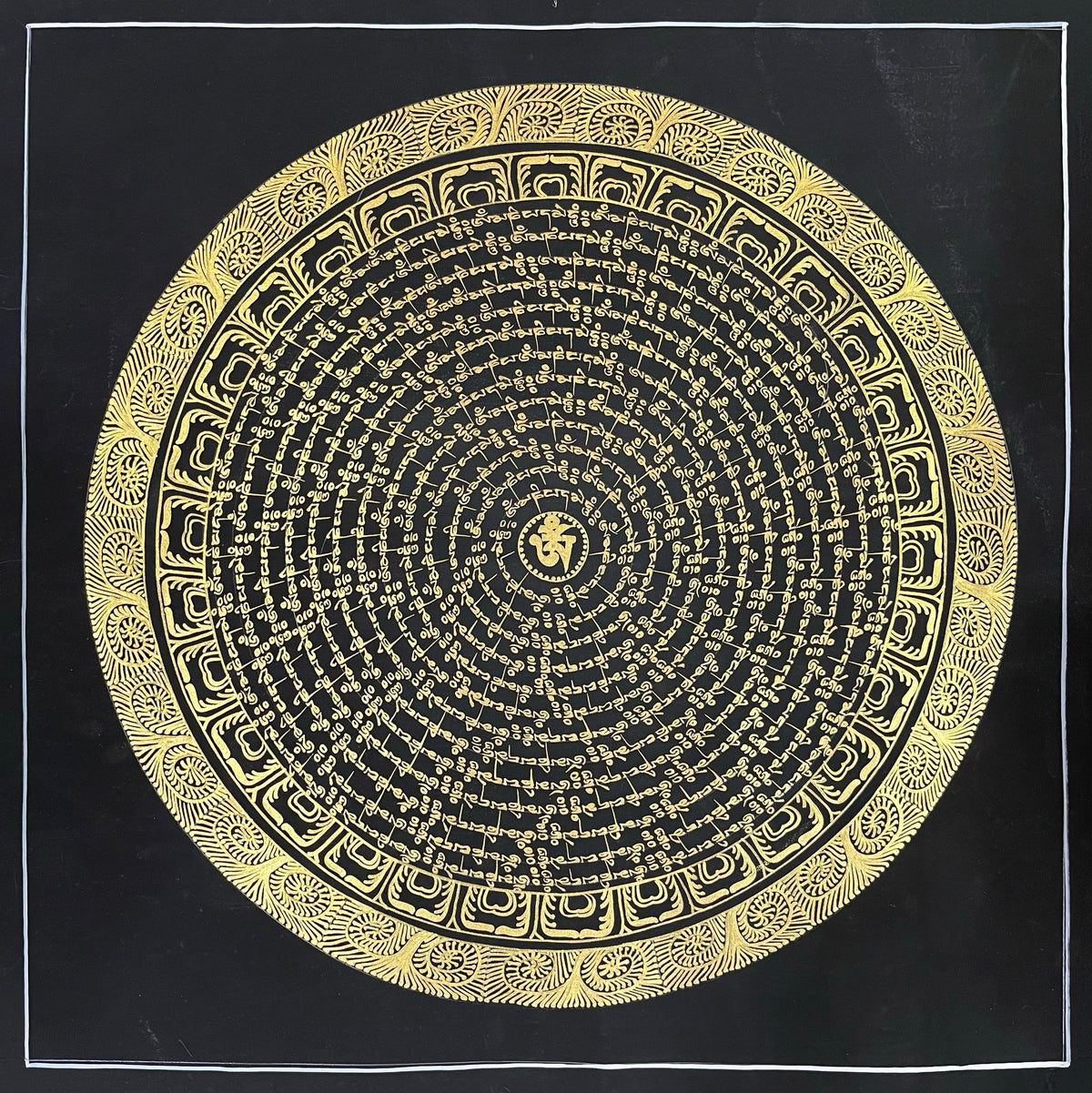 Mantra Mandala thangka, 54×54 cm: concentric rings of gold-coloured mantra script on black around a central Om