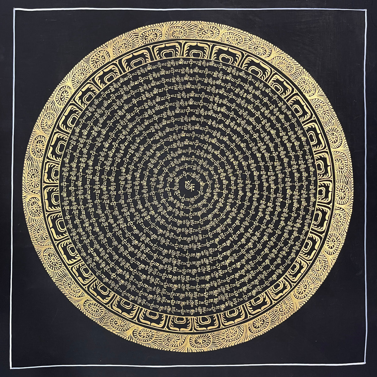 Mantra Mandala thangka, 54×54 cm: concentric rings of gold-coloured mantra script on black around a single syllable