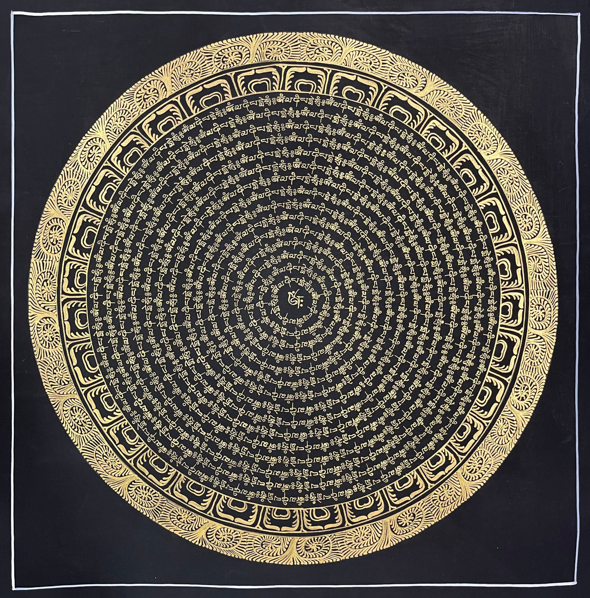 Mantra Mandala thangka, 54×54 cm: concentric rings of gold-coloured mantra script on black around a single syllable