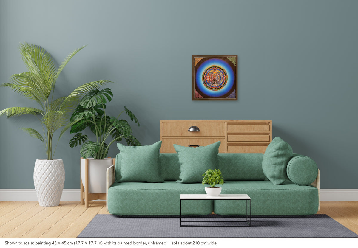 Kalachakra Mandala thangka shown to scale in a living room, unframed, above a sofa about 210 cm wide (45×45 cm)