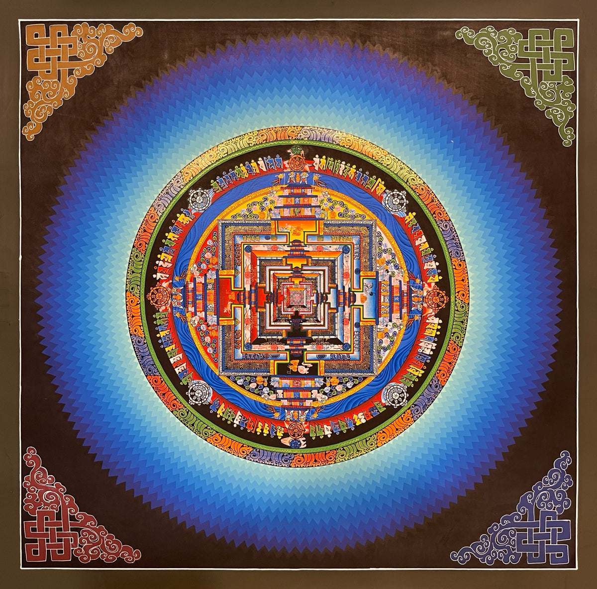 Kalachakra Mandala thangka, 45×45 cm: Kalachakra palace mandala surrounded by zigzag blue rays, with endless knots in the corners