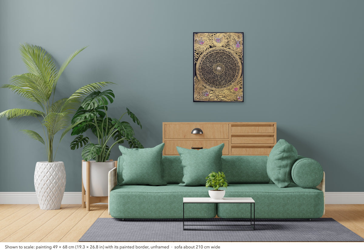 Dragon Mantra Mandala thangka shown to scale in a living room, unframed, above a sofa about 210 cm wide (49×68 cm)