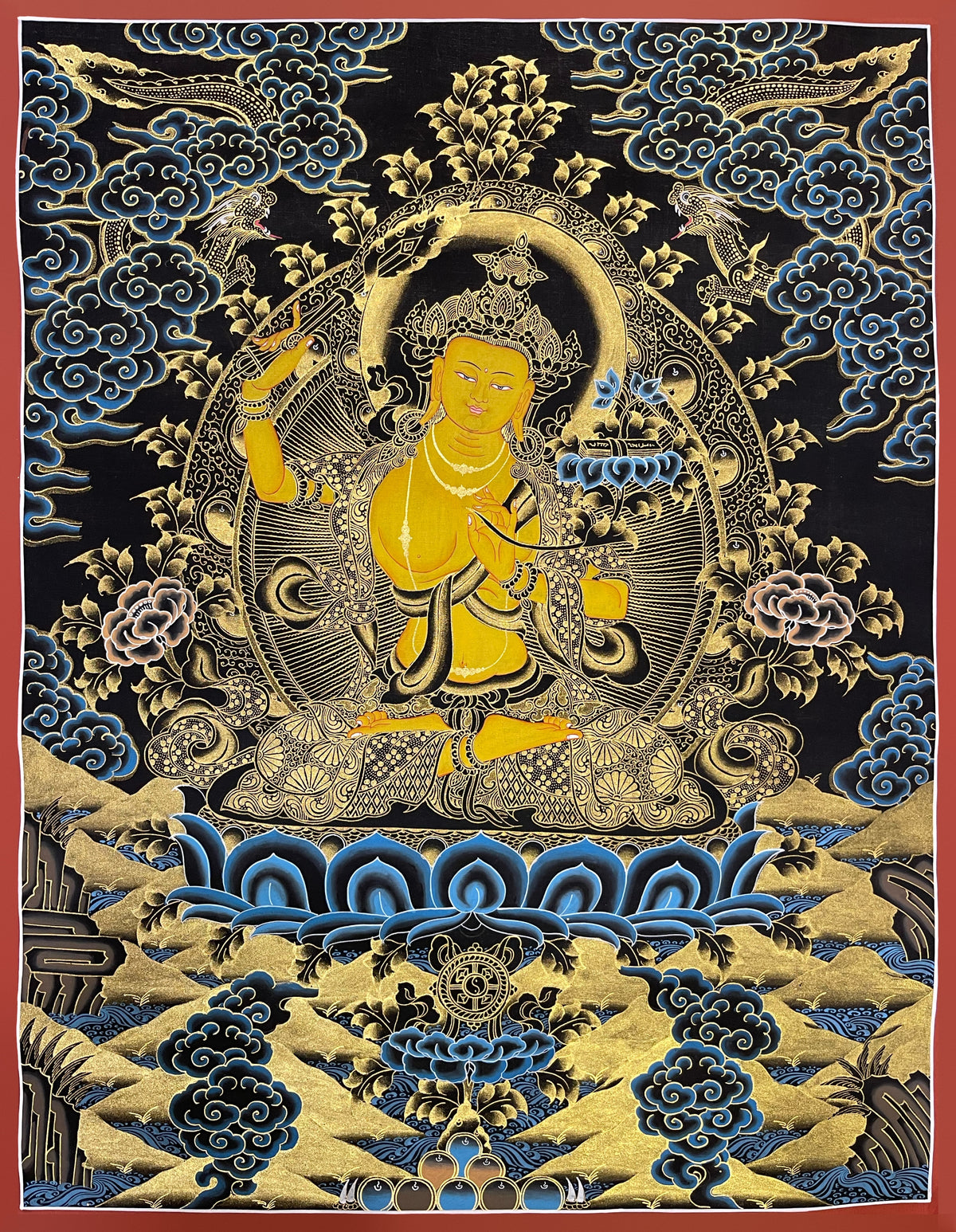 Manjushri thangka, 52×67 cm: yellow Manjushri in black and gold, raising a sword, with a book on a lotus
