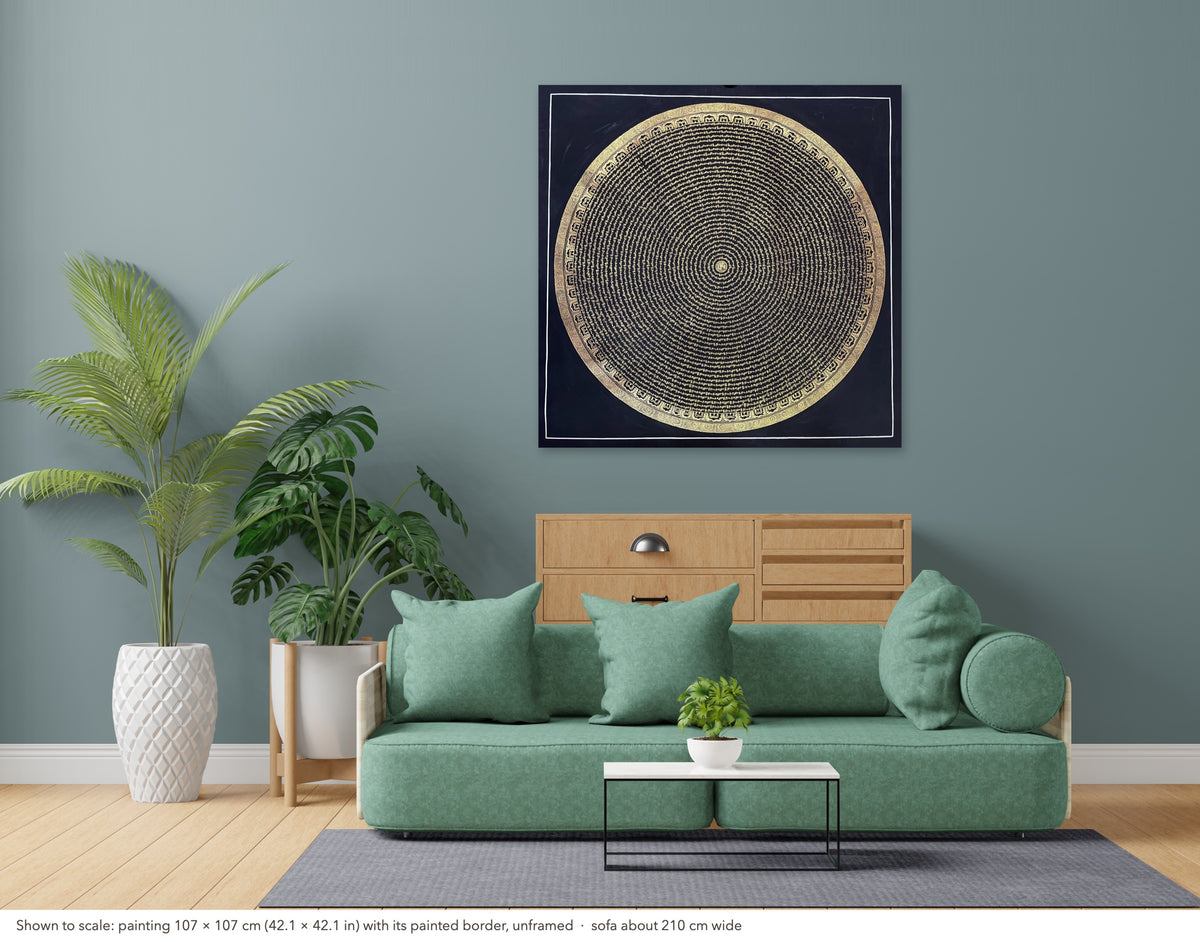 Mantra Mandala thangka shown to scale in a living room, unframed, above a sofa about 210 cm wide (107×107 cm)
