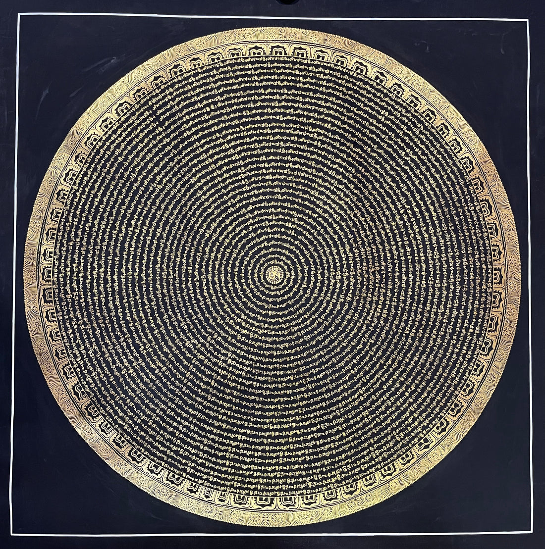 Mantra Mandala thangka, 107×107 cm: concentric rings of gold-coloured Tibetan script on a black ground