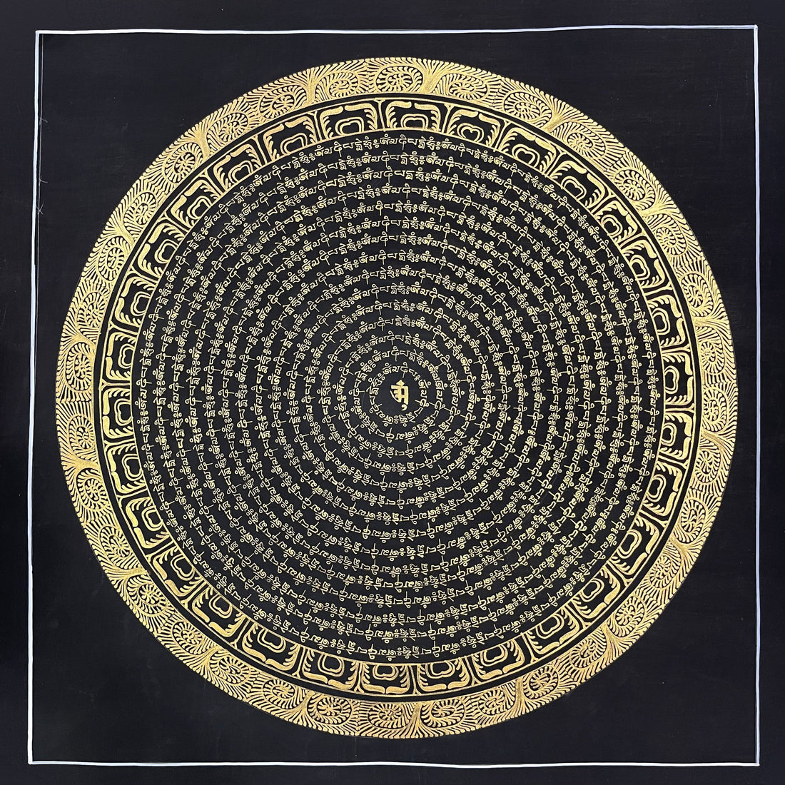 Mantra Mandala thangka, 107×107 cm: rings of gold-coloured mantra script on black around a single syllable