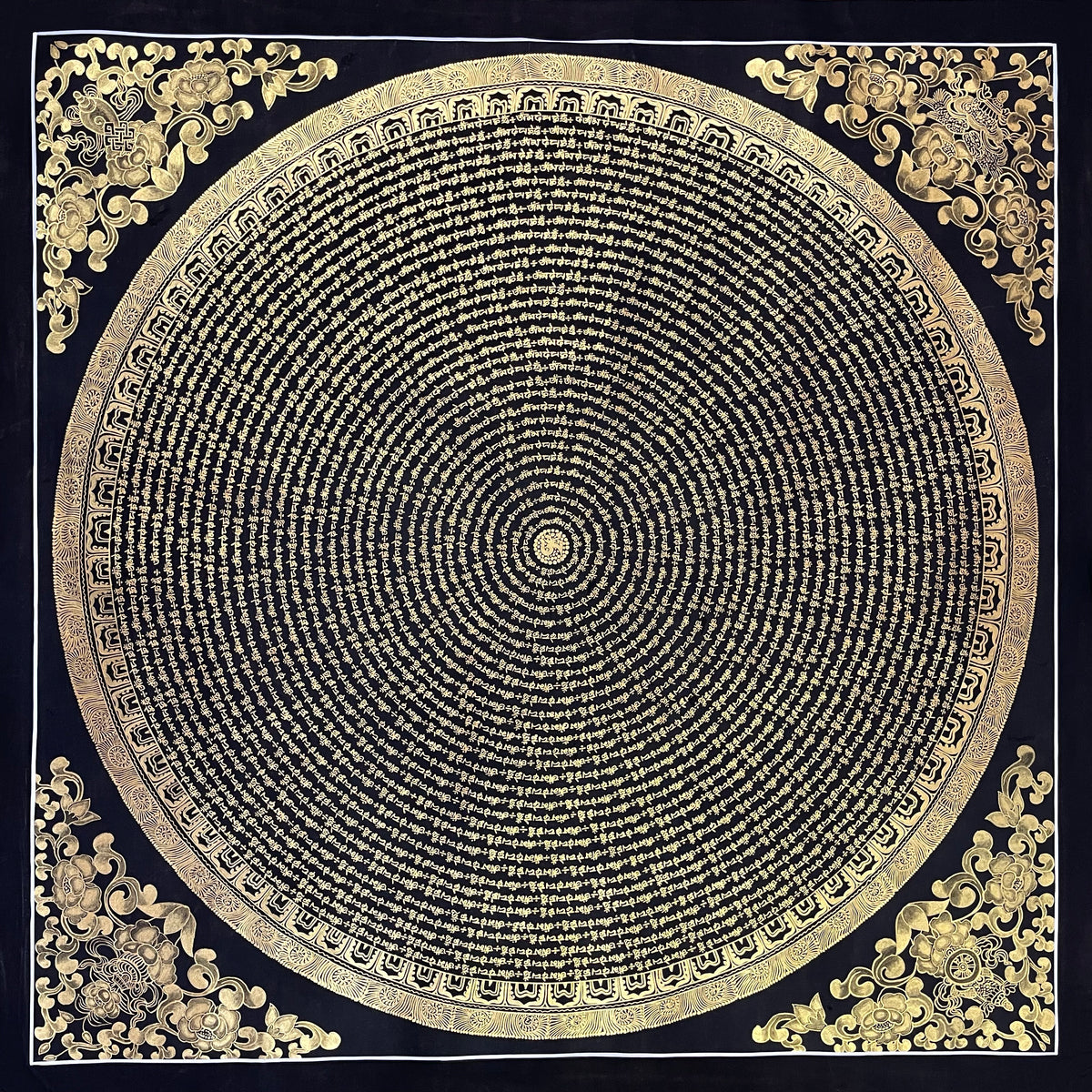 Mantra Mandala thangka, 107×107 cm: concentric rings of gold-coloured mantra script on black, with gold-coloured peonies in the corners