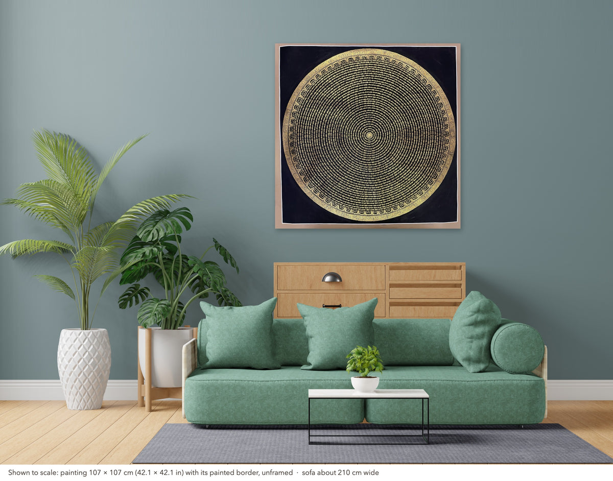 Mantra Mandala thangka shown to scale in a living room, unframed, above a sofa about 210 cm wide (107×107 cm)