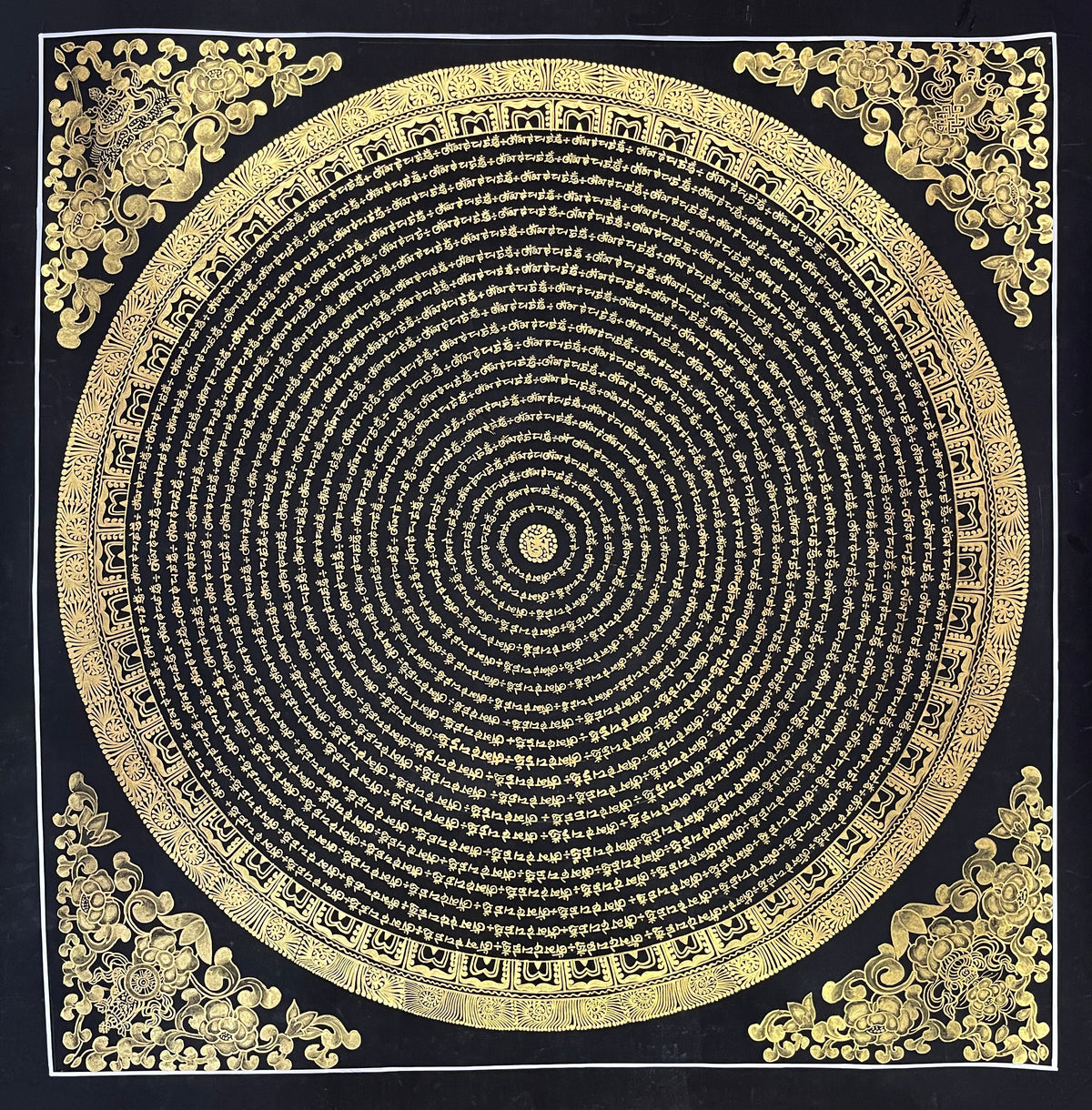 Mantra Mandala thangka, 80×80 cm: concentric rings of gold-coloured mantra script on black, with gold-coloured peonies in the corners
