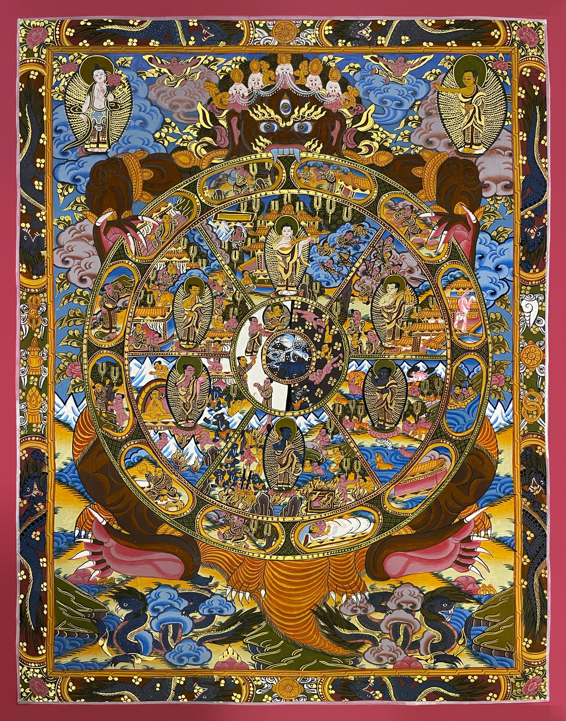 Wheel of Life thangka, 44×55 cm: dark brown Yama holding the Wheel of Life with a Buddha in each realm, inside a border of dragons