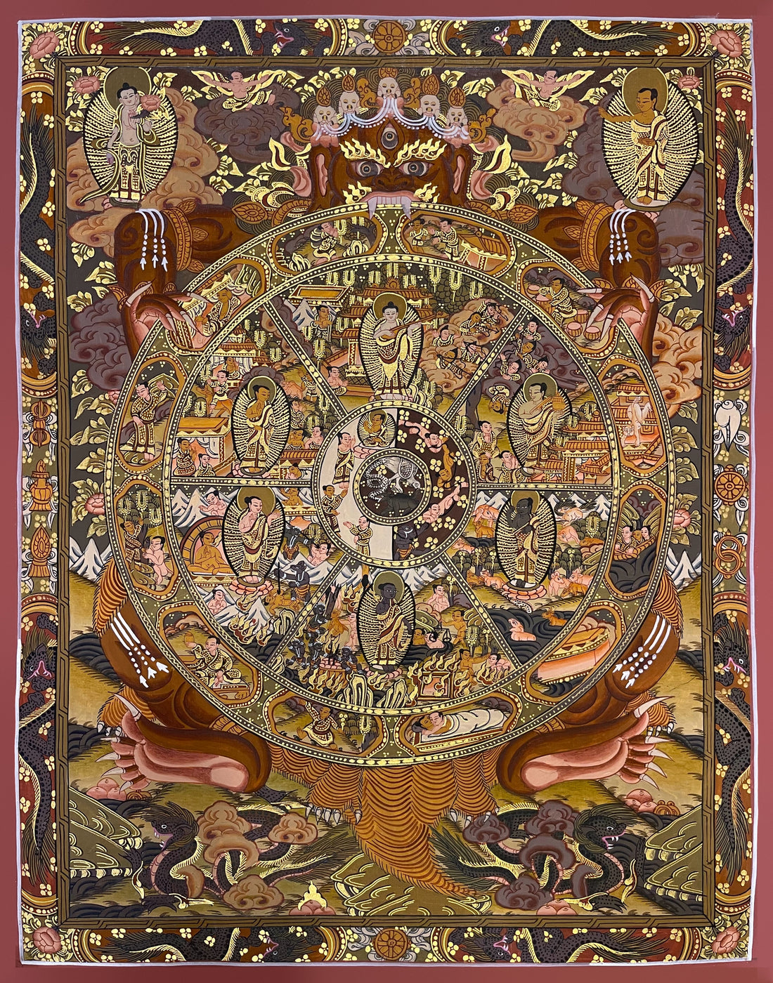 Wheel of Life thangka, 44×56 cm: brown Yama holding the Wheel of Life in ochre and gold-coloured tones, with a Buddha in each realm