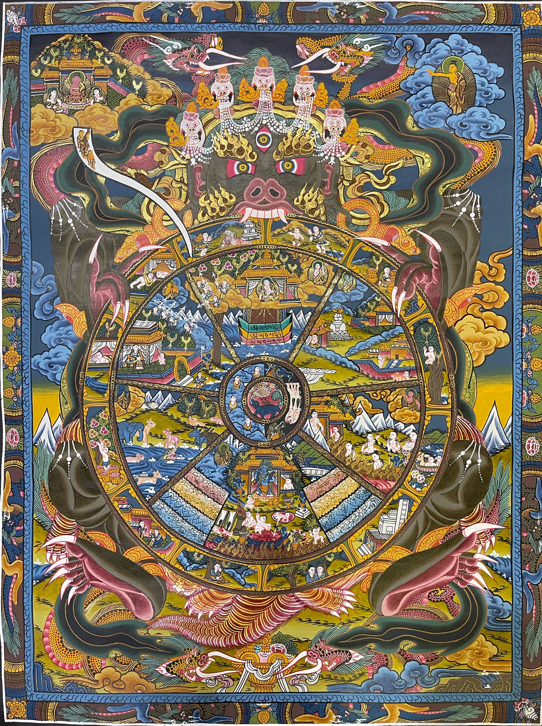 Wheel of Life thangka, 52×66 cm: dark Yama holding the Wheel of Life, with Buddhas in the upper corners, under a dark blue sky
