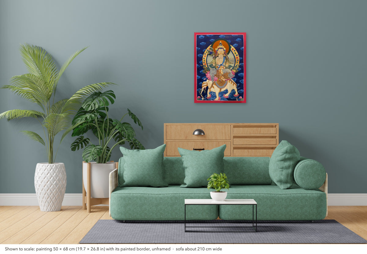 Samantabhadra Bodhisattva thangka shown to scale in a living room, unframed, above a sofa about 210 cm wide (50×68 cm)