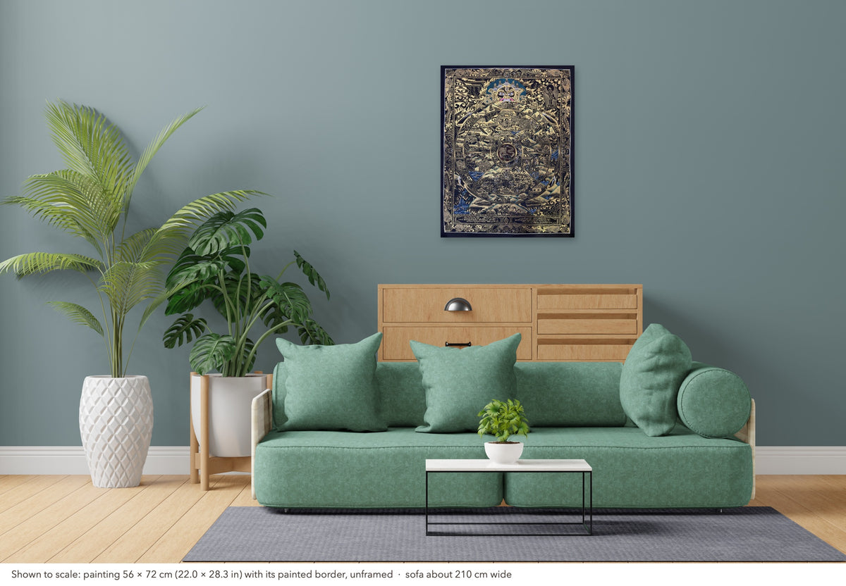 Wheel of Life thangka shown to scale in a living room, unframed, above a sofa about 210 cm wide (56×72 cm)