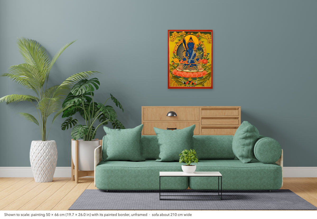 Manjushri thangka shown to scale in a living room, unframed, above a sofa about 210 cm wide (50×66 cm)