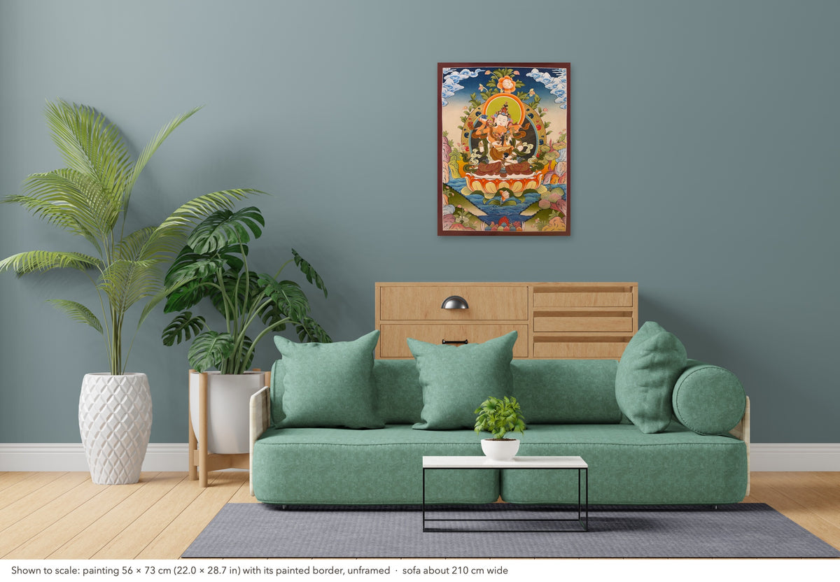 Vajrasattva with Consort thangka shown to scale in a living room, unframed, above a sofa about 210 cm wide (56×73 cm)