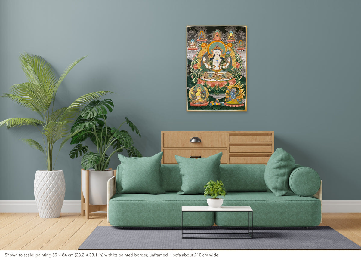 Chenrezig thangka shown to scale in a living room, unframed, above a sofa about 210 cm wide (59×84 cm)