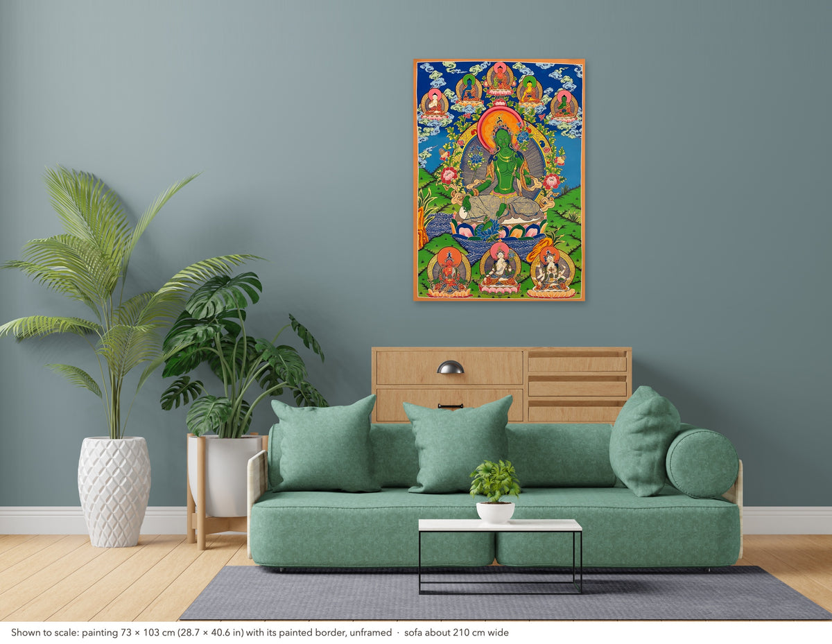 Green Tara thangka shown to scale in a living room, unframed, above a sofa about 210 cm wide (73×103 cm)