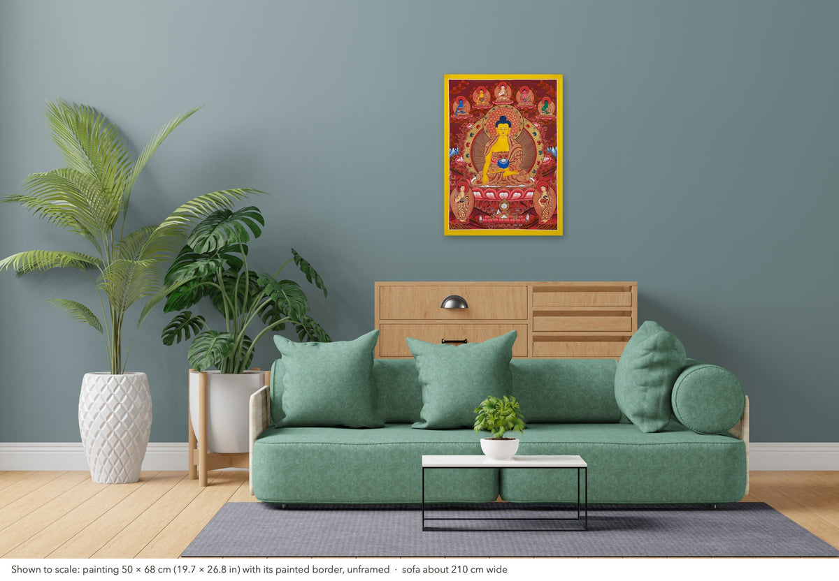 Shakyamuni Buddha thangka shown to scale in a living room, unframed, above a sofa about 210 cm wide (50×68 cm)