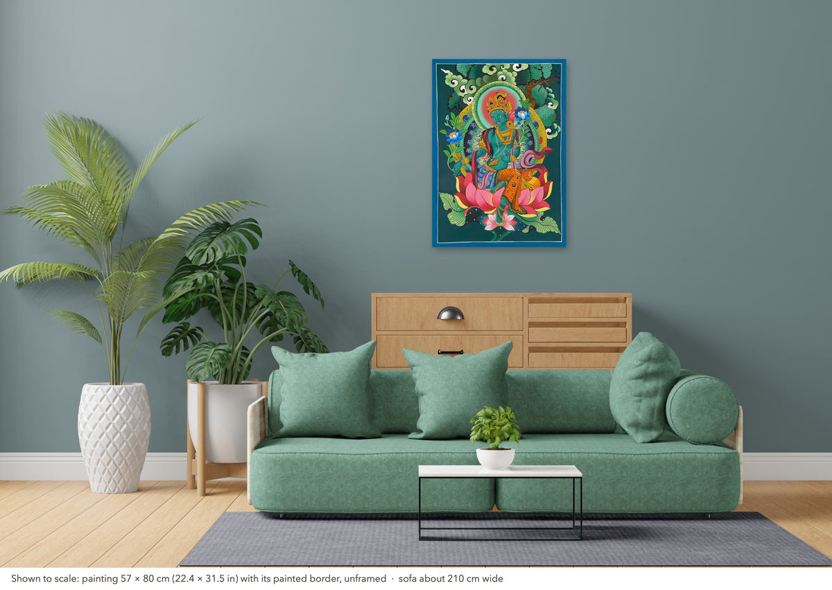 Green Tara thangka shown to scale in a living room, unframed, above a sofa about 210 cm wide (57×80 cm)