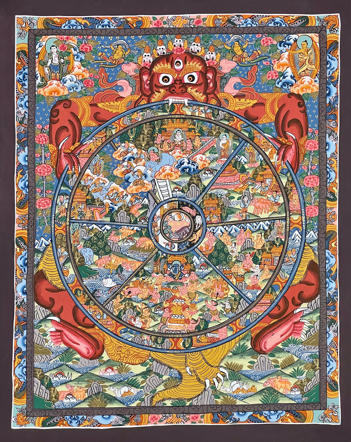 Wheel of Life thangka, 45×53 cm: red Yama holding a densely painted Wheel of Life, inside a border of dragons