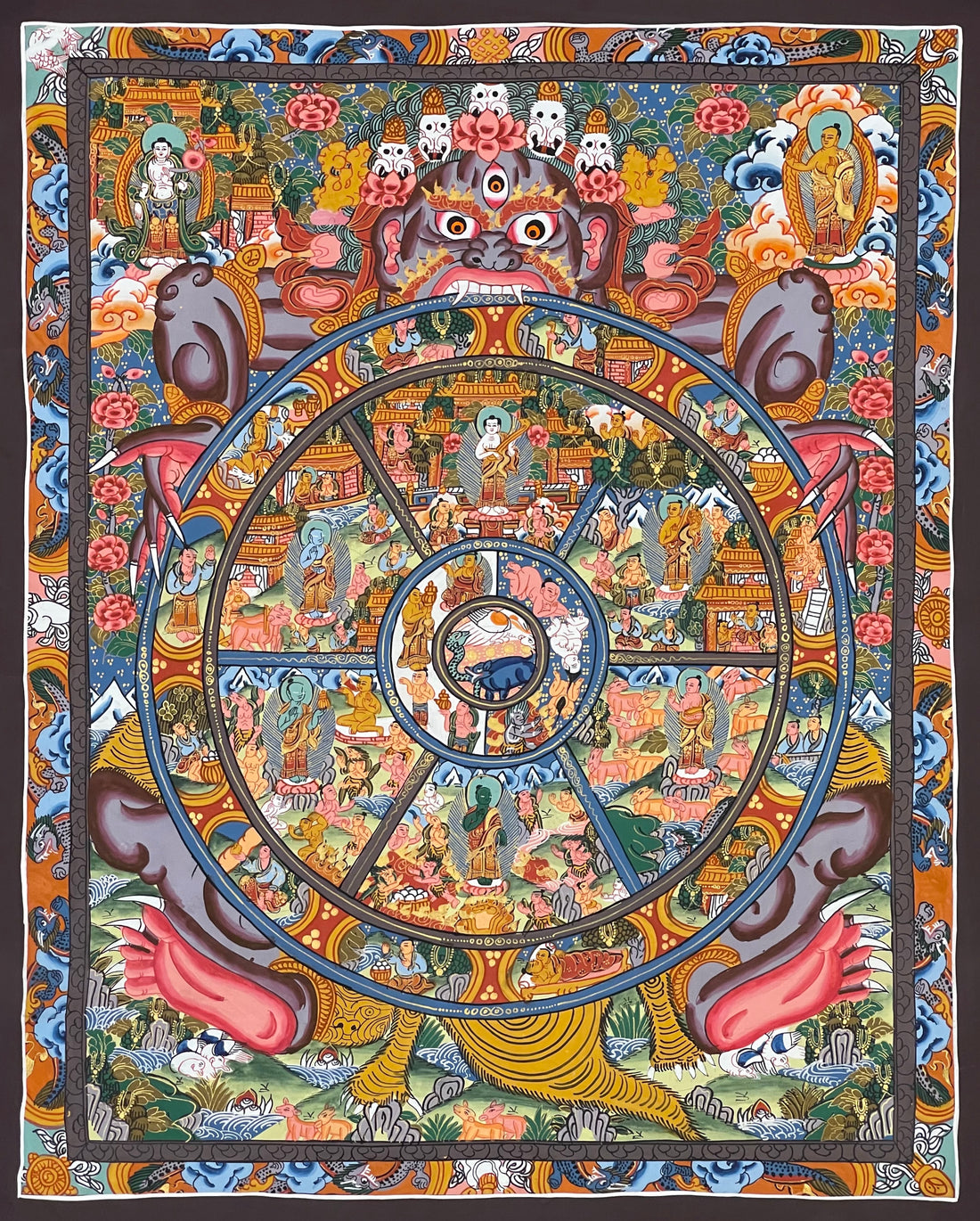 Wheel of Life thangka, 43×52 cm: grey-blue Yama holding the Wheel of Life with a Buddha in each realm, inside a border of dragons