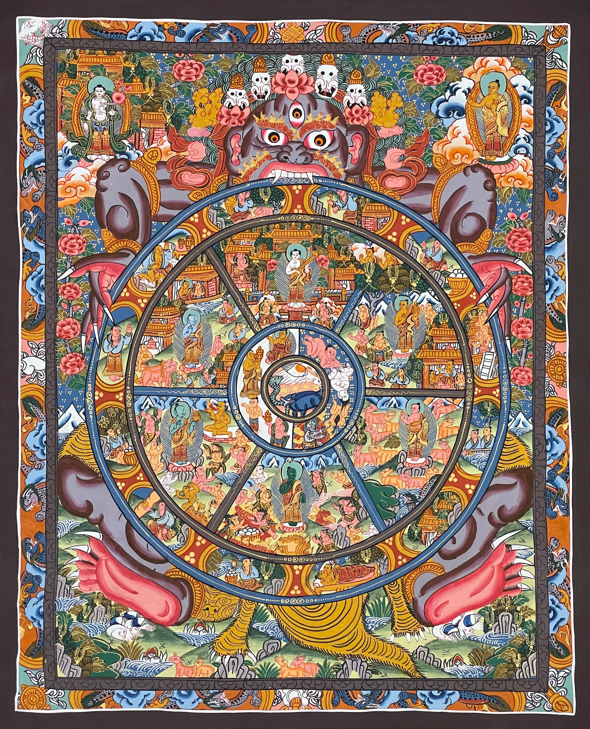 Wheel of Life thangka, 43×52 cm: grey-blue Yama holding the Wheel of Life with a Buddha in each realm, inside a border of dragons