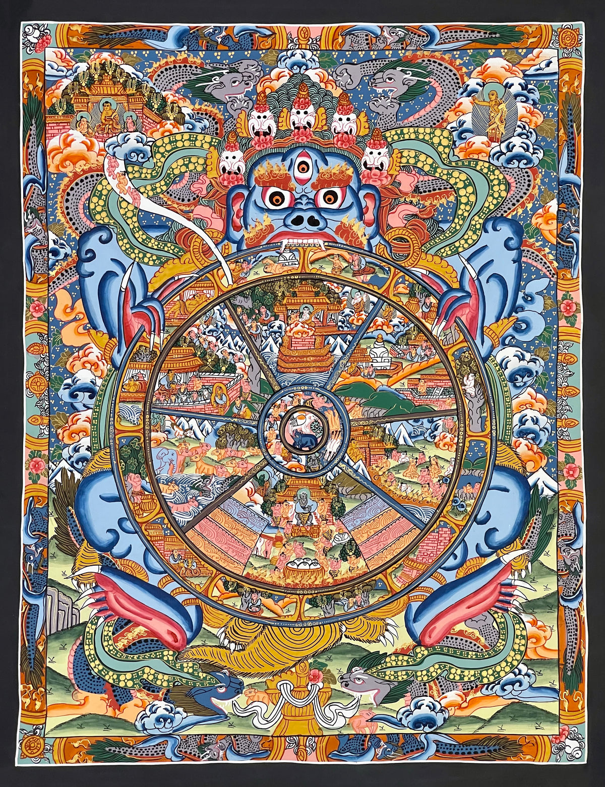 Wheel of Life thangka, 44×53 cm: blue Yama holding a densely painted Wheel of Life, inside a border of dragons