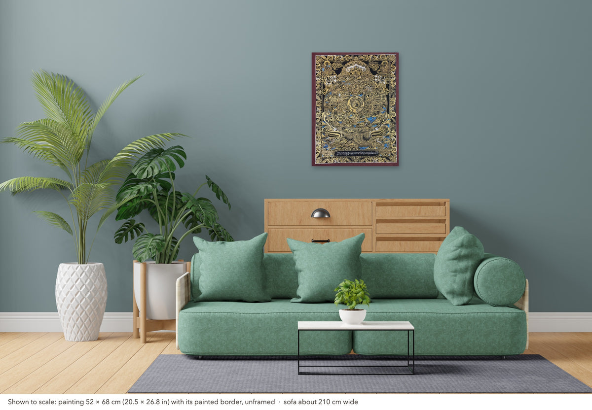 Wheel of Life thangka shown to scale in a living room, unframed, above a sofa about 210 cm wide (52×68 cm)