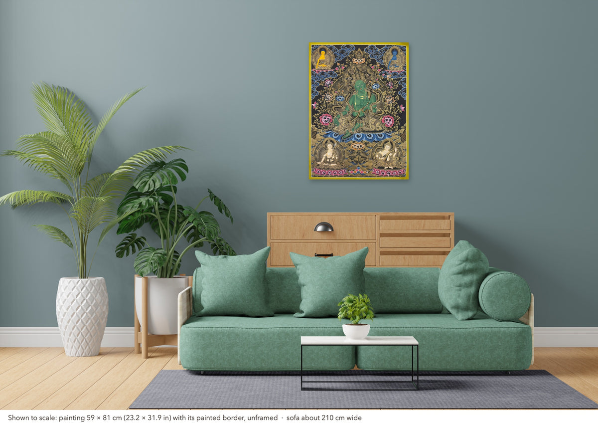 Green Tara thangka shown to scale in a living room, unframed, above a sofa about 210 cm wide (59×81 cm)
