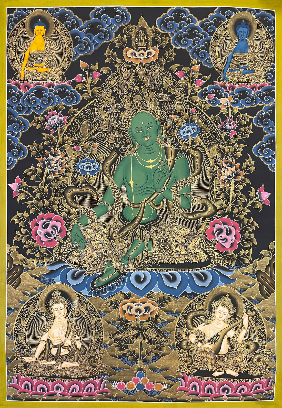 Green Tara thangka, 59×81 cm: Green Tara in black and gold, with two Buddhas above and Saraswati below