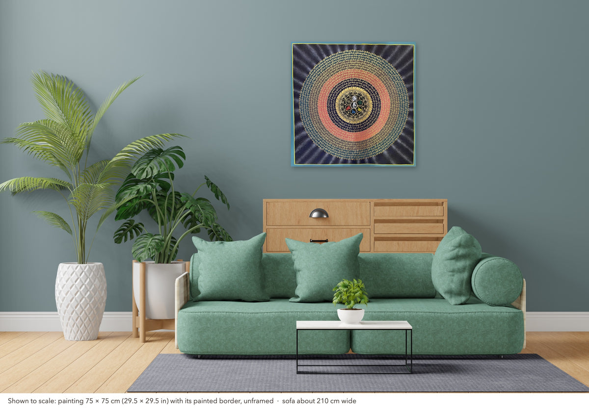 Mantra Mandala thangka shown to scale in a living room, unframed, above a sofa about 210 cm wide (75×75 cm)
