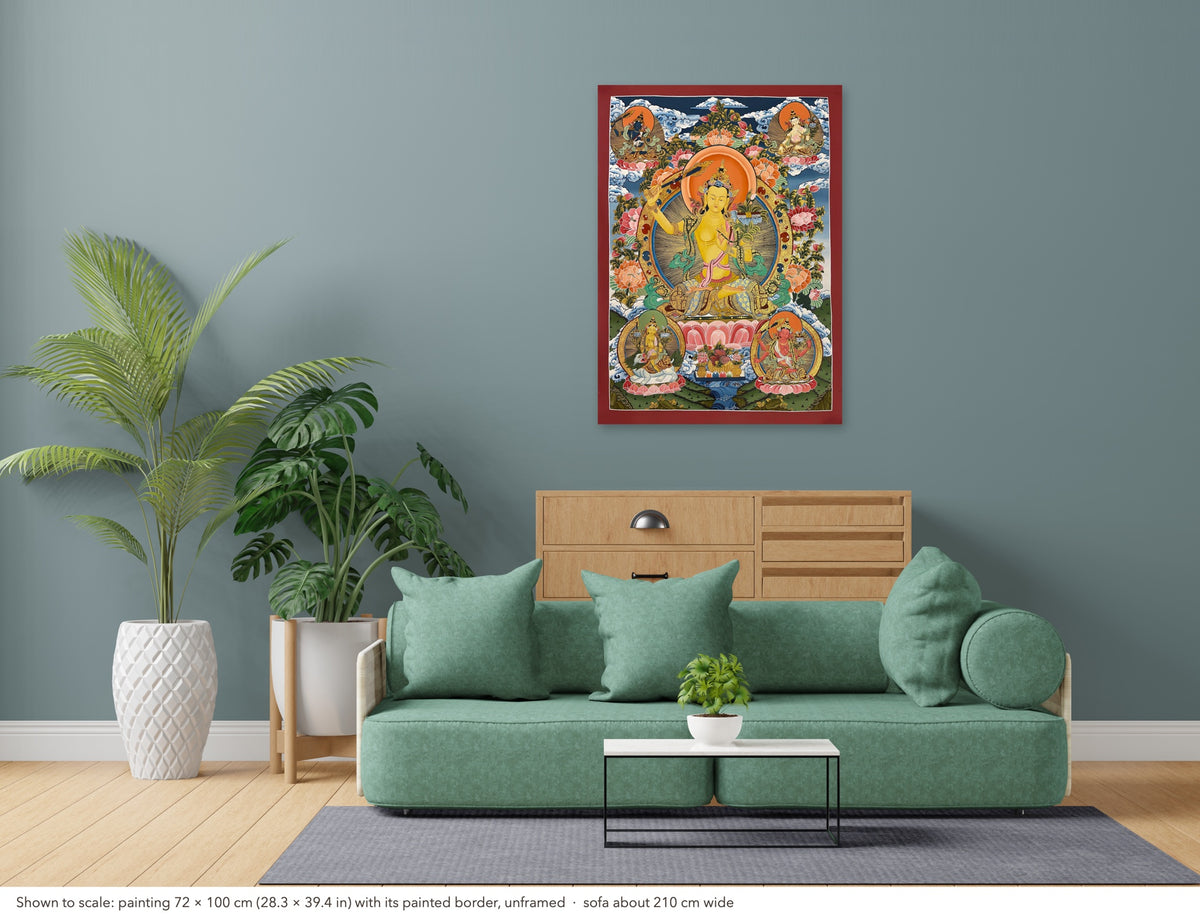 Manjushri thangka shown to scale in a living room, unframed, above a sofa about 210 cm wide (72×100 cm)