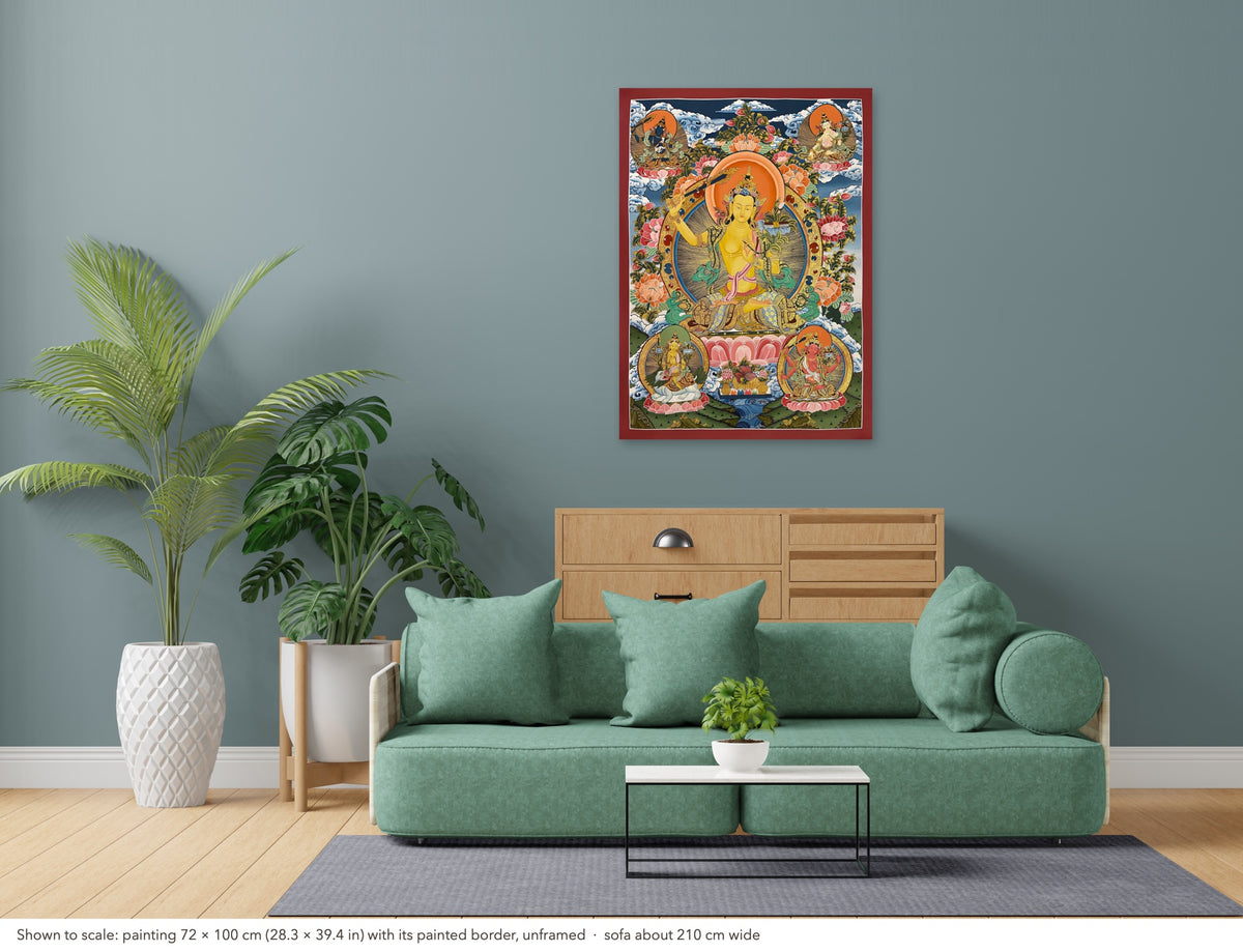 Manjushri thangka shown to scale in a living room, unframed, above a sofa about 210 cm wide (72×100 cm)