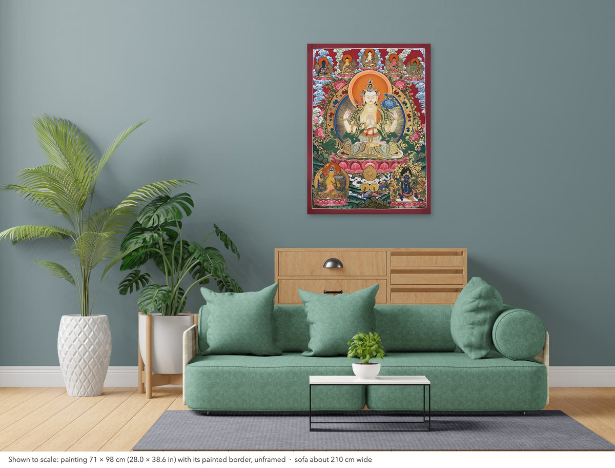 Chenrezig thangka shown to scale in a living room, unframed, above a sofa about 210 cm wide (71×98 cm)