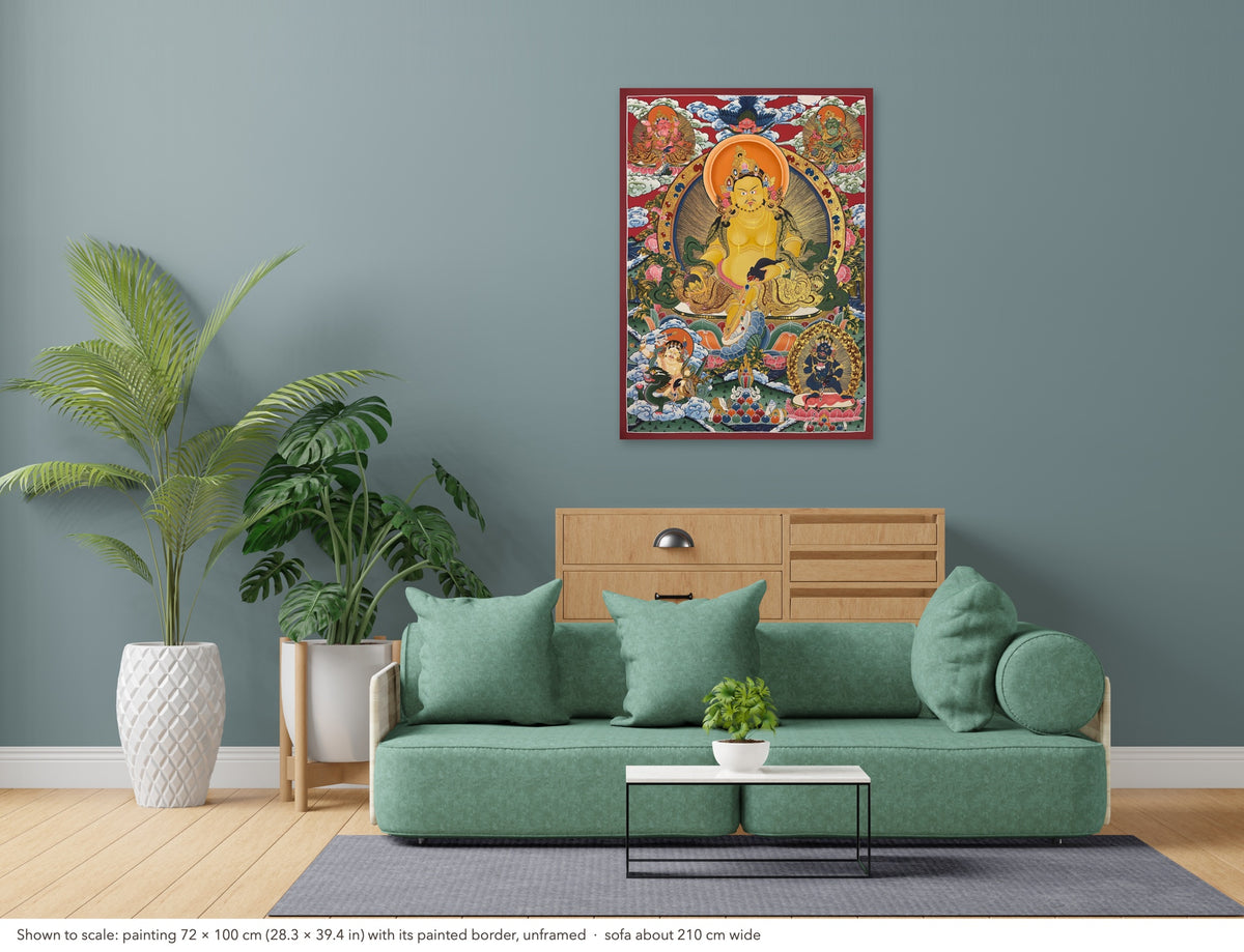 Jambhala thangka shown to scale in a living room, unframed, above a sofa about 210 cm wide (72×100 cm)