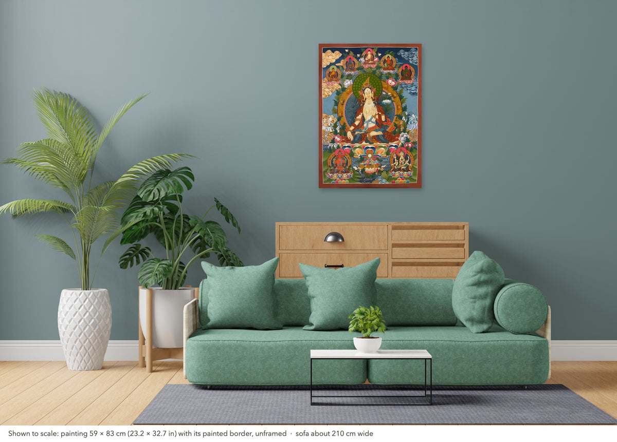 White Tara thangka shown to scale in a living room, unframed, above a sofa about 210 cm wide (59×83 cm)