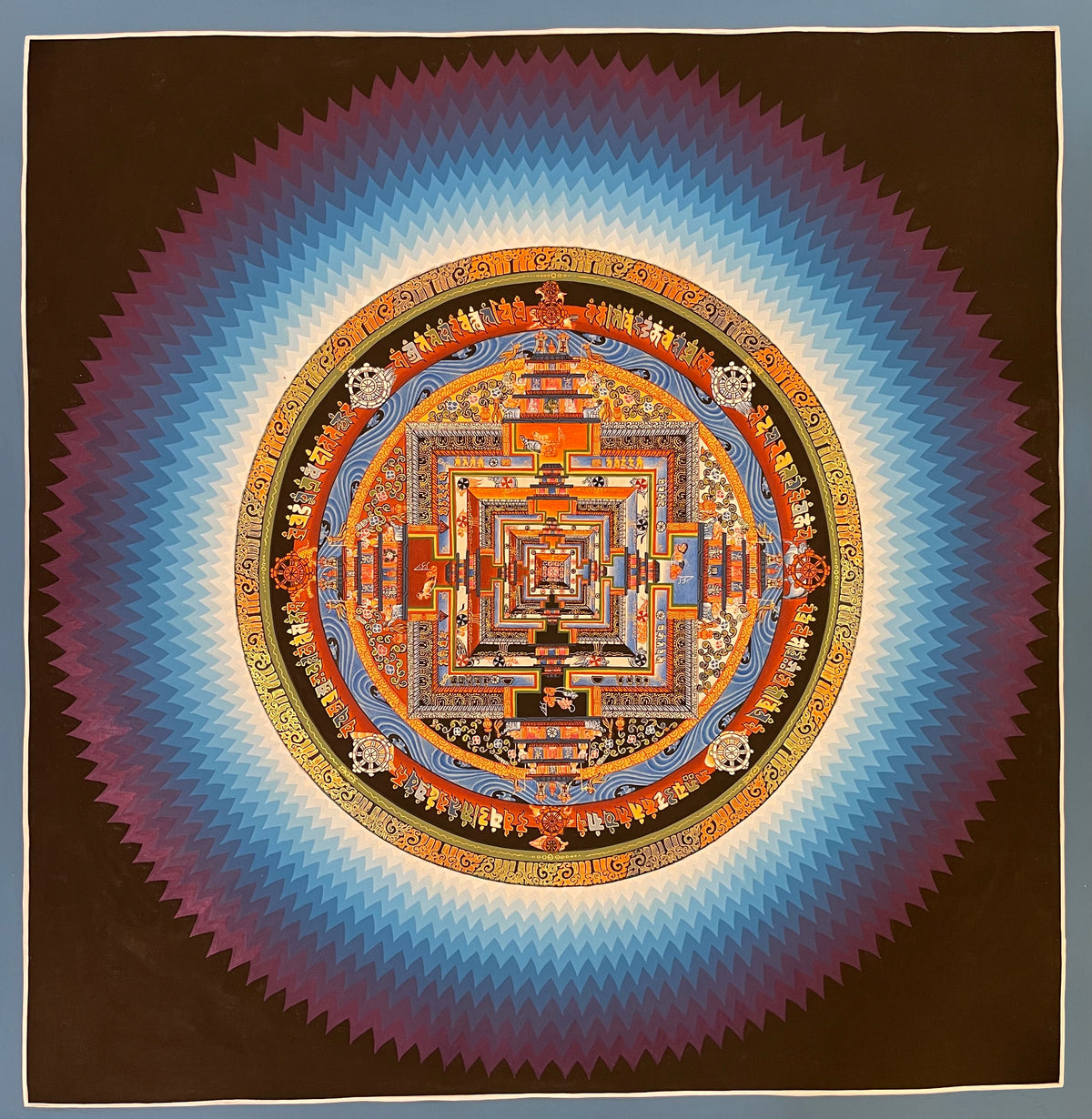 Kalachakra Mandala thangka, 55×55 cm: Kalachakra palace mandala surrounded by zigzag rays shading from white to violet