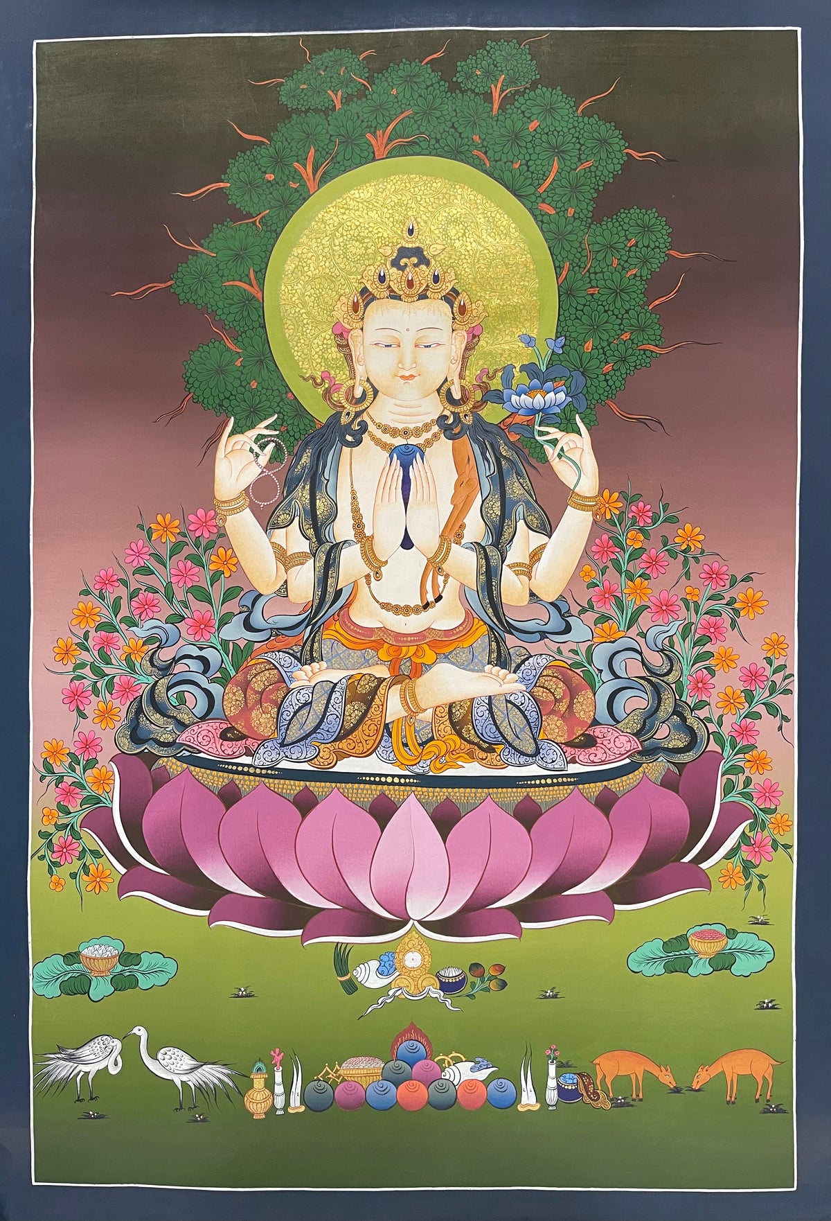Chenrezig thangka, 59×85 cm: four-armed Chenrezig on a large pink lotus under a tree, with cranes, deer and offerings below