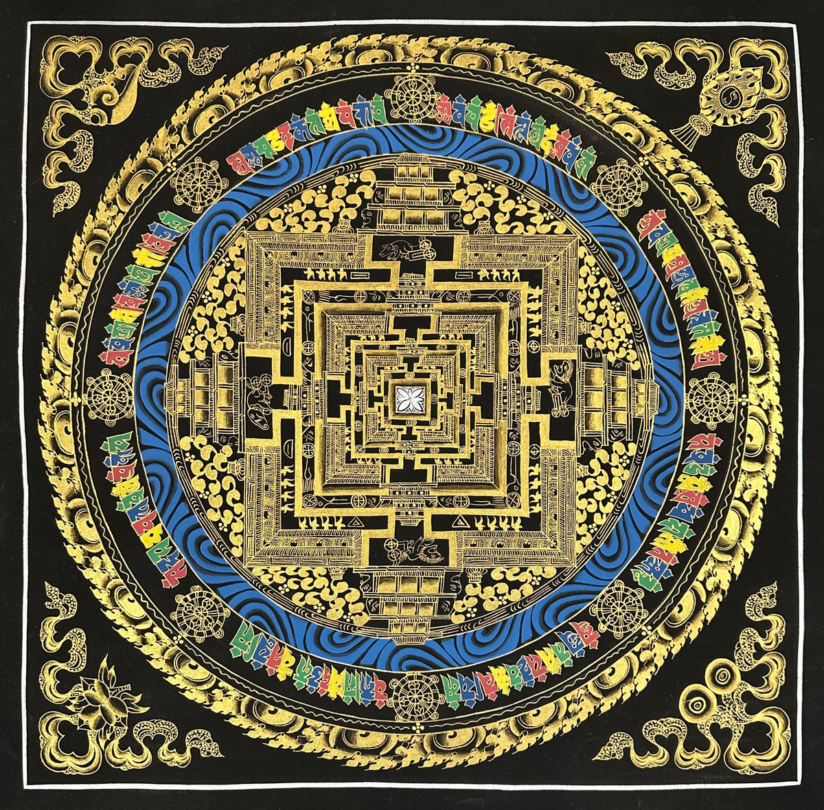 Kalachakra Mandala thangka, 55×55 cm: Kalachakra palace mandala in gold-coloured line work on black, with a ring of blue water and coloured syllables