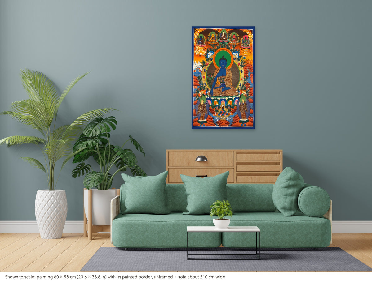 Medicine Buddha thangka shown to scale in a living room, unframed, above a sofa about 210 cm wide (60×98 cm)