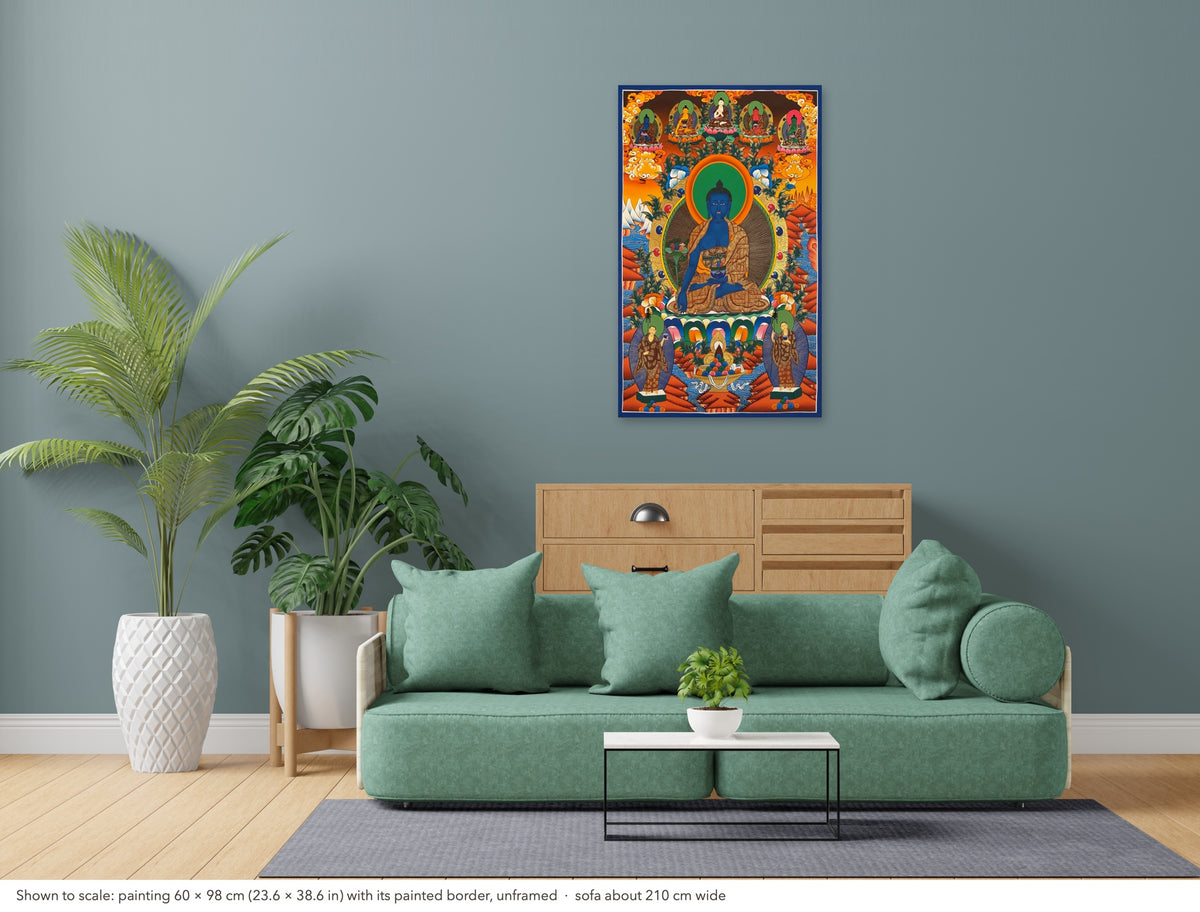 Medicine Buddha thangka shown to scale in a living room, unframed, above a sofa about 210 cm wide (60×98 cm)