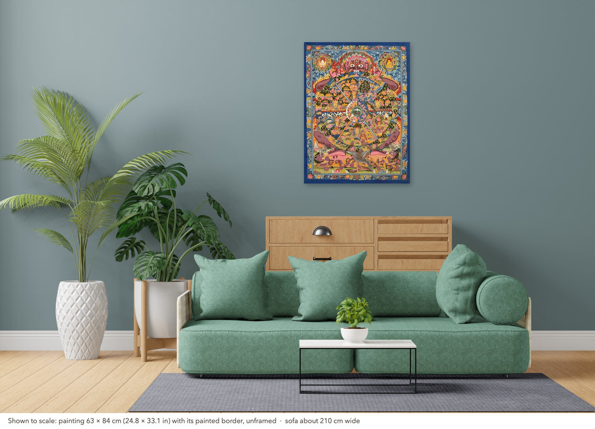 Wheel of Life thangka shown to scale in a living room, unframed, above a sofa about 210 cm wide (63×84 cm)